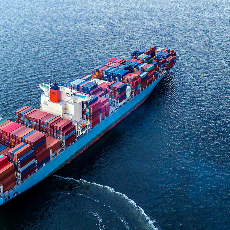 Aerial view fof a container ship at sea, import export and business logistic.
